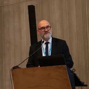 Man talking at a podium.