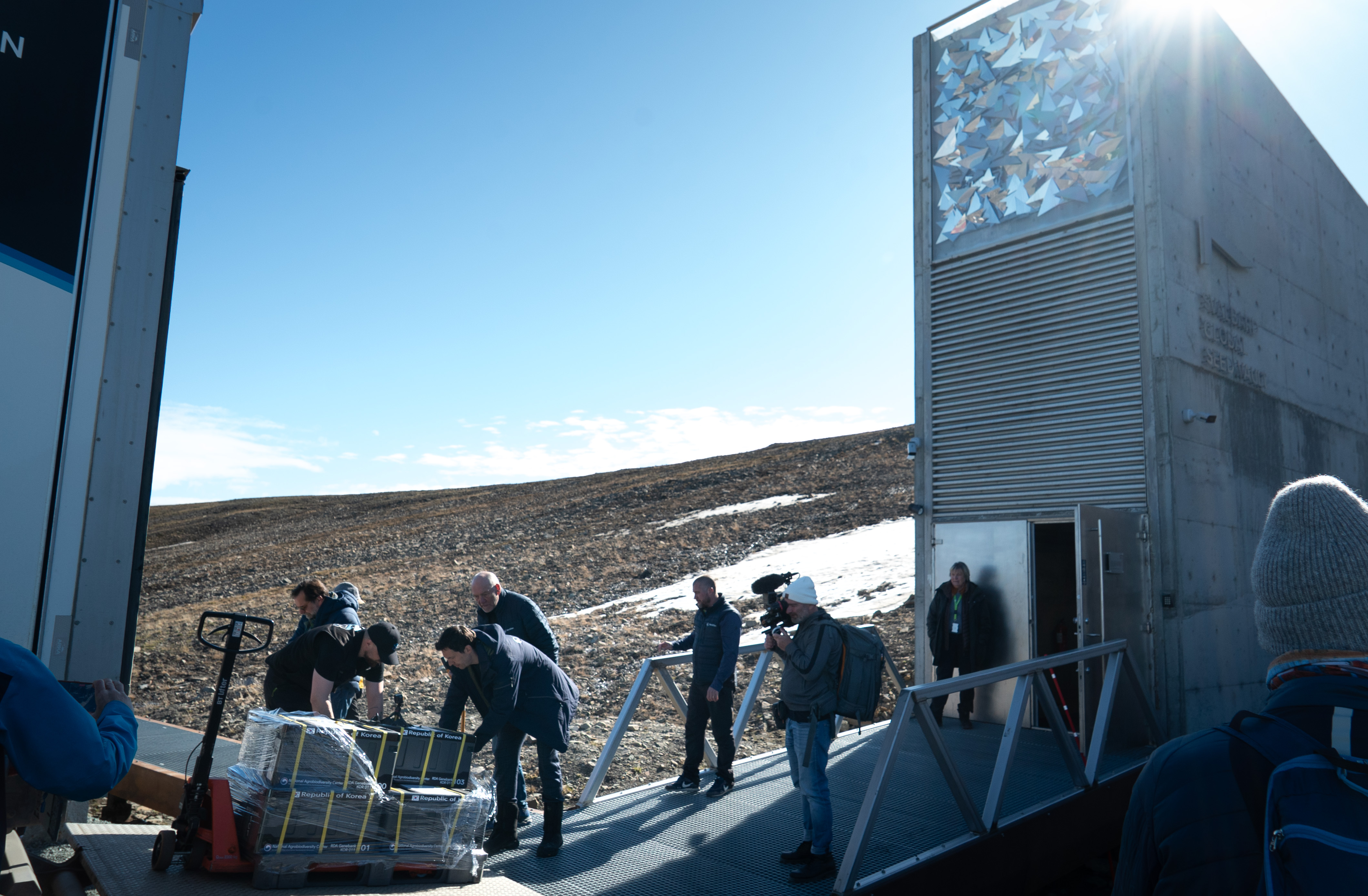 People carrying boxes.